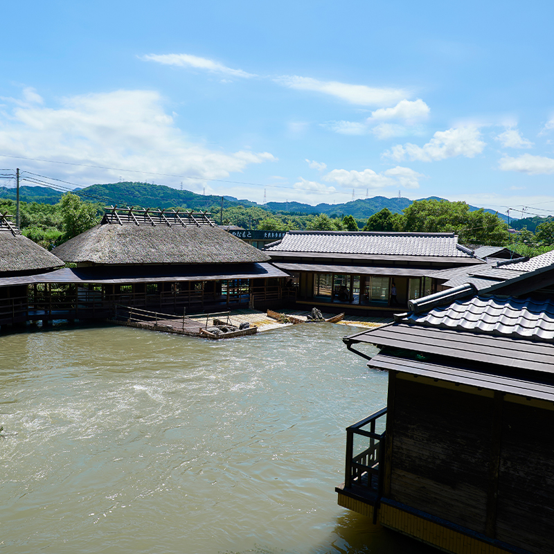 Five thatched-roof pavilions